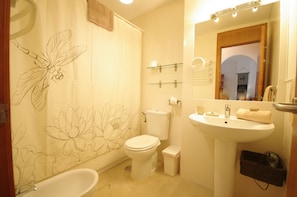 Bathtub, hair dryer, towels