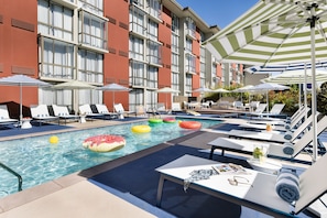 Outdoor pool, open 9:00 AM to 8:00 PM, pool umbrellas, pool loungers