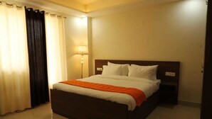 Executive Suite | Living room | Fireplace - PLLAZIO Residency (Gurugram)