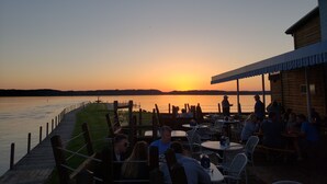 A lakeside restaurant with outdoor seating overlooking the water. - Come and enjoy beautiful Torch Lake! (Bellaire)