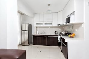 Family Condo, 2 Bedrooms | Private kitchen | Full-size fridge, microwave, oven, stovetop