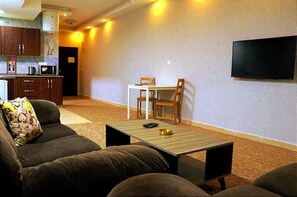 Apartment, 1 Bedroom | Living area | 43-inch LED TV with satellite channels, TV