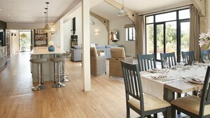 A spacious kitchen with a dining area, wooden floors, and large windows. - Bokes Barn, Hawkhurst , Kent (Hawkhurst, Cranbrook)