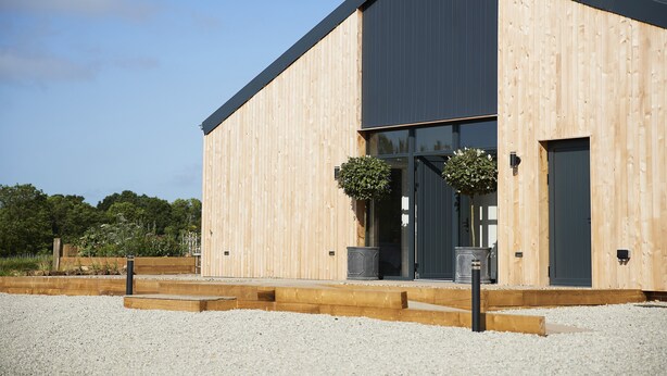 A modern building with a wooden exterior and a dark roof. - Bokes Barn, Hawkhurst , Kent (Hawkhurst, Cranbrook)