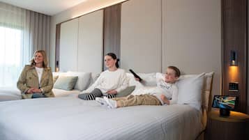 Relax in a spacious room with a large bed and flat-screen TV for entertainment.