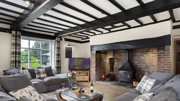 A cozy living room with a fireplace, comfortable seating, and a television. - Broad  Meadows (12), Bayton , Worcestershire (Kidderminster)