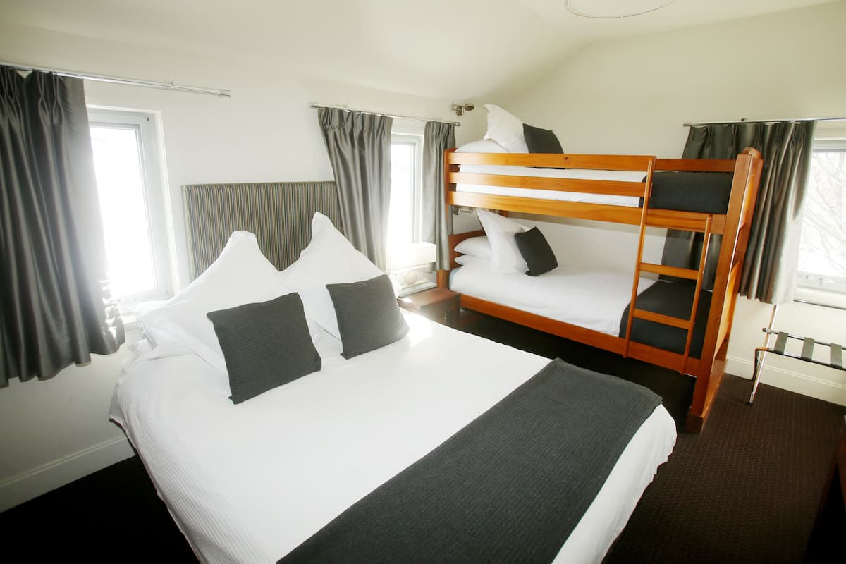 Standard Quadruple Room | Blackout curtains, bed sheets