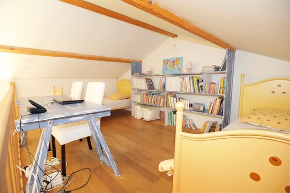 A room with a wooden ceiling, a desk with a chair, a bookshelf, and a bed. - House with private pool in the countryside (Marsalès)