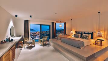 Suite Deluxe | Minibar con snack e bevande gratuite, una cassaforte in camera