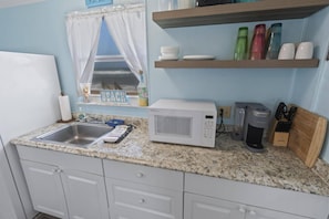 Fridge, microwave, coffee/tea maker, toaster
