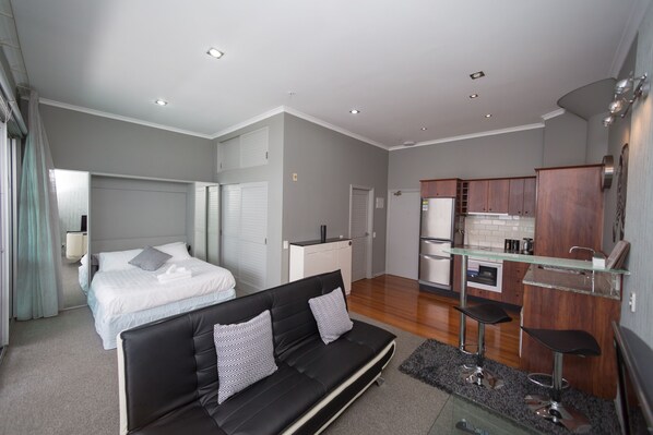 Apartment, 1 Bedroom | Living area | Flat-screen TV