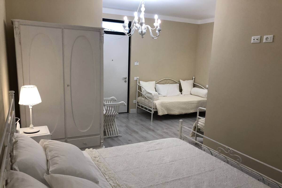 Family Room | Down comforters, desk, laptop workspace, soundproofing