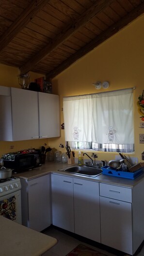 Microwave, coffee/tea maker, cookware/dishes/utensils