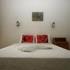 Laptop workspace, bed sheets