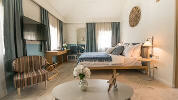 Suite Deluxe | 1 habitación, minibar y caja de seguridad en la habitación