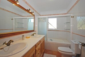 Bathtub, hair dryer, towels