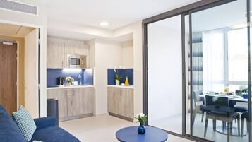 Appartement (Executive) | Coin séjour | Télévision à écran plat