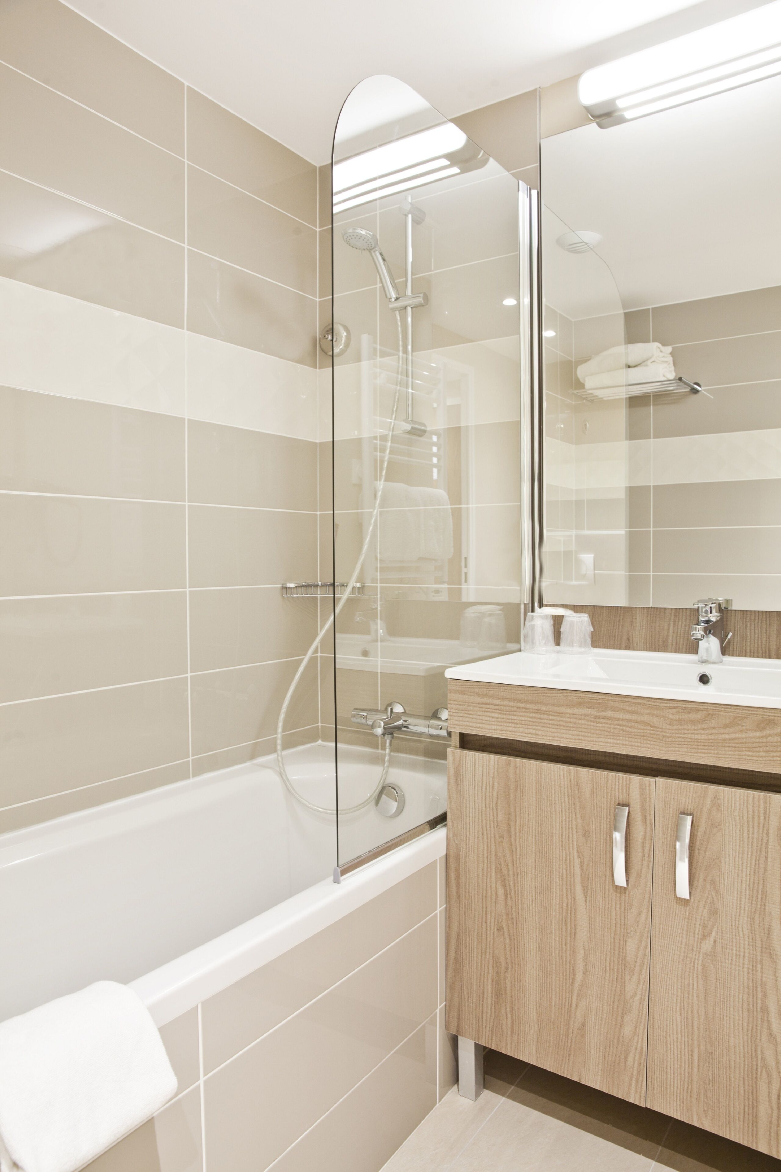 Bathtub, hair dryer, slippers, towels