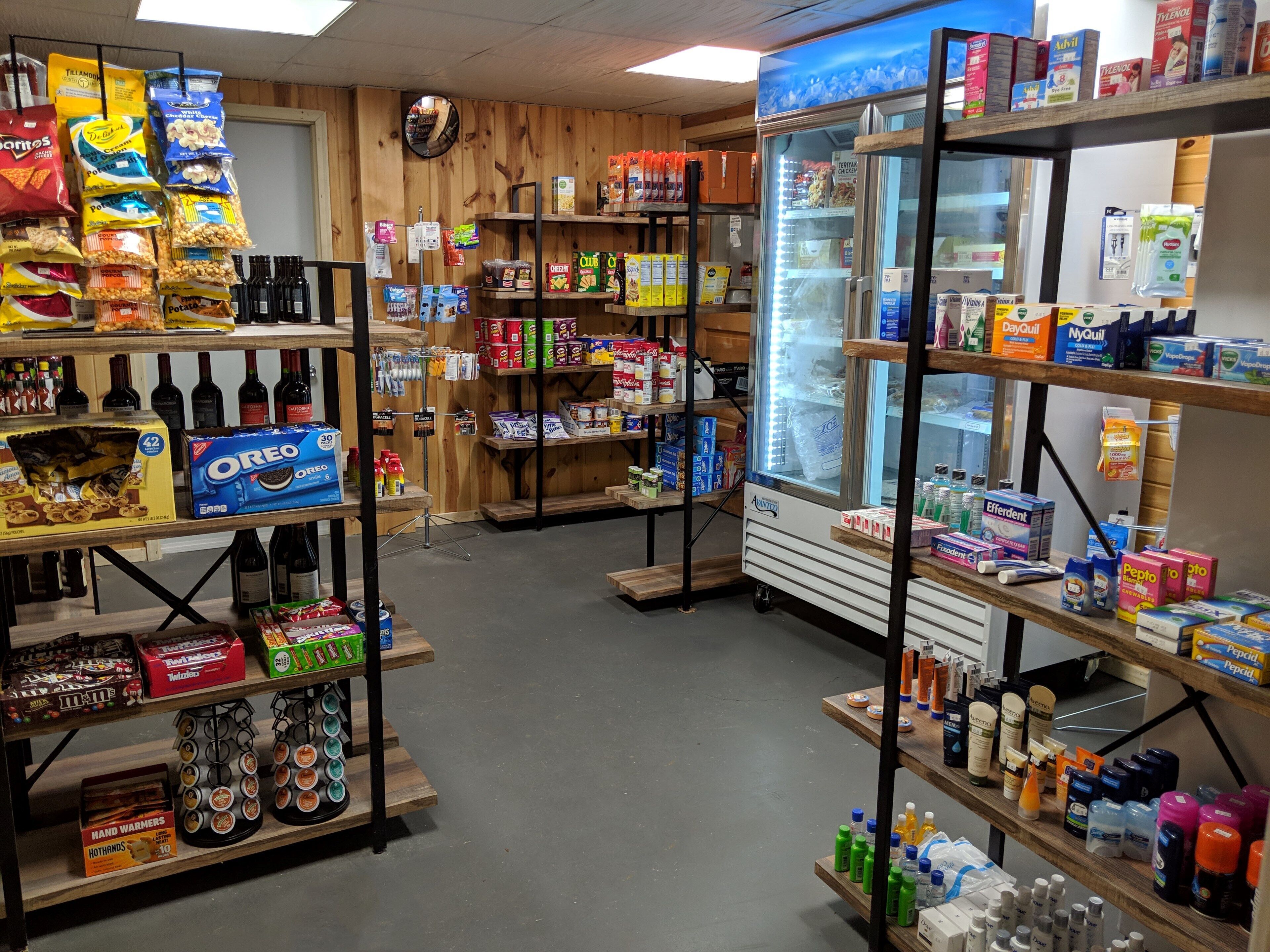 A store with shelves stocked with snacks, beverages, and household items.