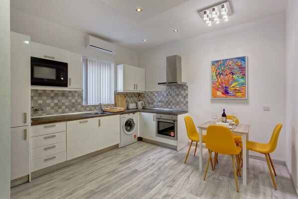 Apartment (1 Bedroom) | Private kitchen | Oven, toaster, cookware/dishes/utensils, dining tables