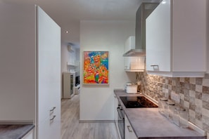 Apartamento, 1 quarto | Cozinha privada | Fogão, cooktop, torradeira, cadeirão de bebê