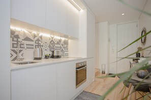 Studio | Private kitchenette | Full-sized fridge, microwave, oven, stovetop - Liiiving in Porto - Cozy & Chic Downtown (Porto)