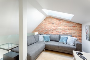 Apartment, 3 Bedrooms | Living room | Flat-screen TV