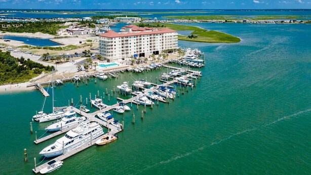 An aerial view of a hotel with a marina, boats docked, and a clear blue sky. - Incredible Views - Magnificent Sunsets
I Little Piece of Heaven
 (Beaufort)