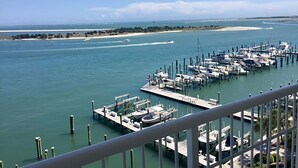 A marina with boats docked at piers, a clear sky, and a sandy beach in the distance. - Incredible Views - Magnificent Sunsets
I Little Piece of Heaven
 (Beaufort)