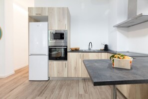 Fridge, microwave, stovetop, coffee/tea maker