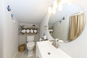 Combined shower/tub, hair dryer, towels, soap