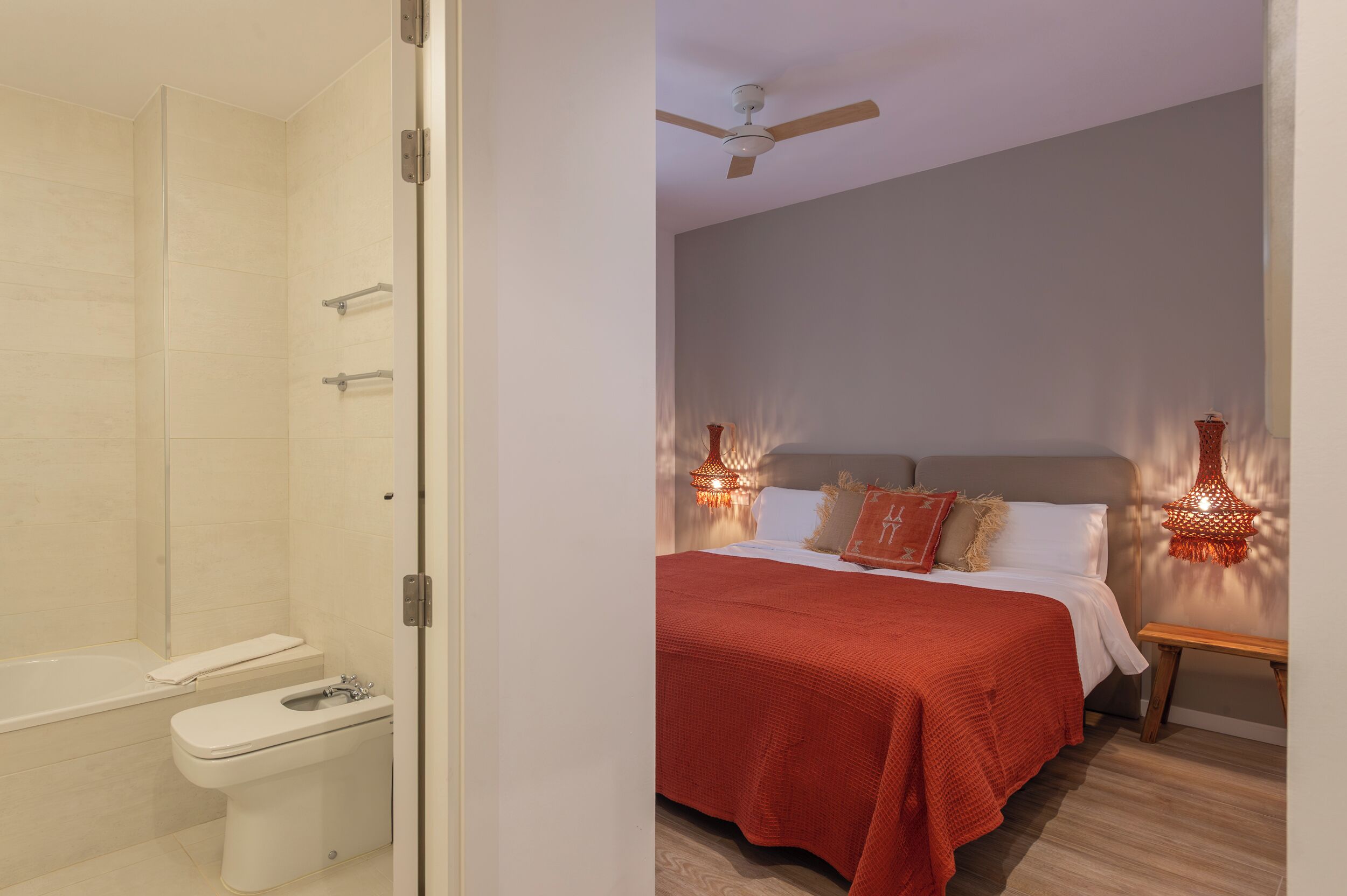 A bathroom with a shower, toilet, and sink.