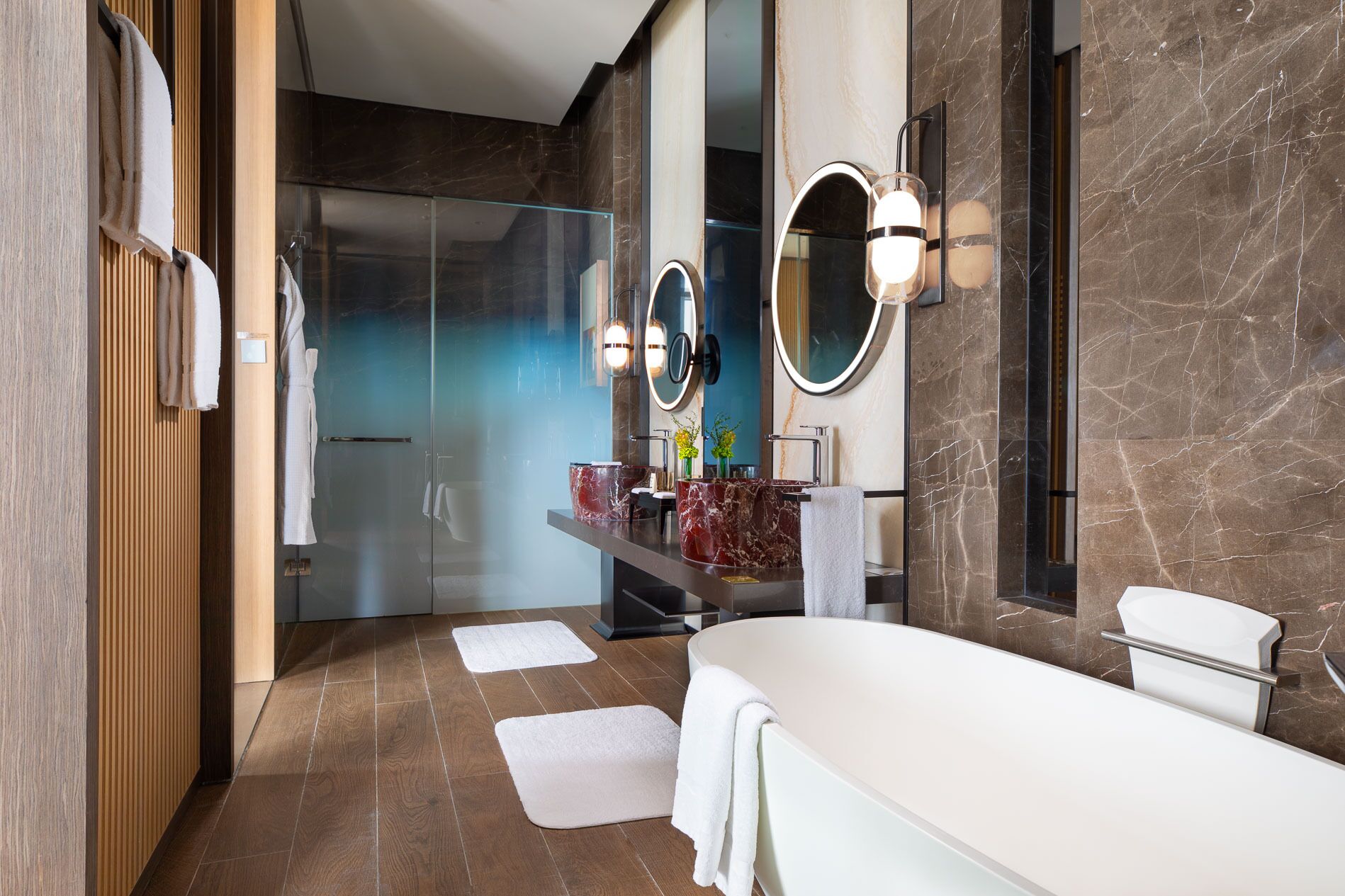 deluxe suite | bathroom | separate bathtub and shower, rainfall showerhead, designer toiletries
