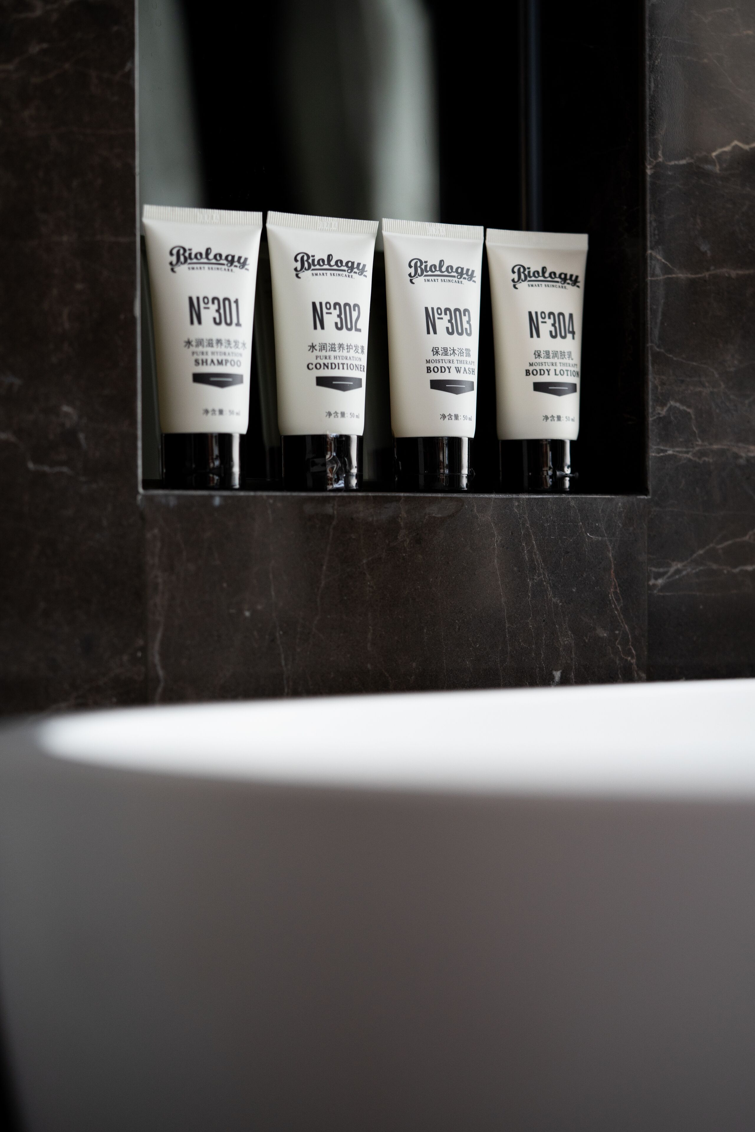 separate bathtub and shower, rainfall showerhead, designer toiletries