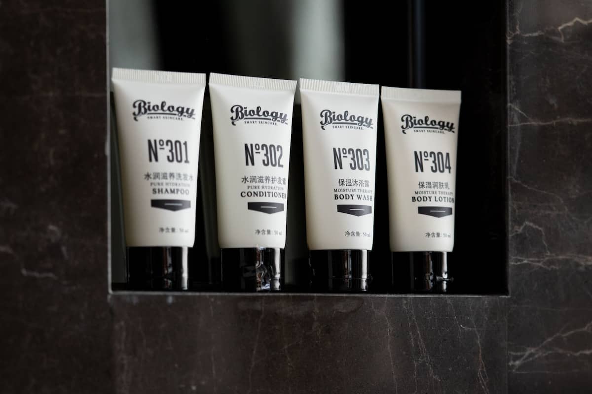 separate bathtub and shower, rainfall showerhead, designer toiletries