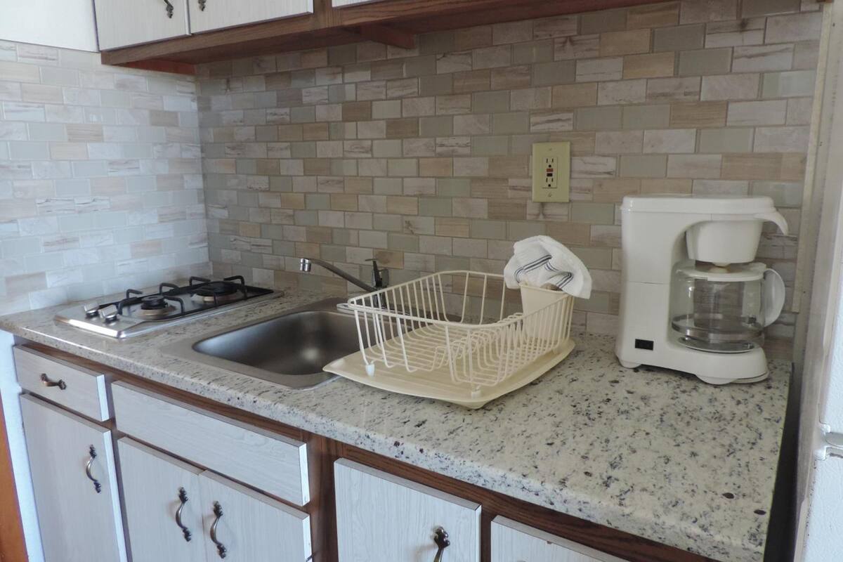 full-sized fridge, microwave, stovetop