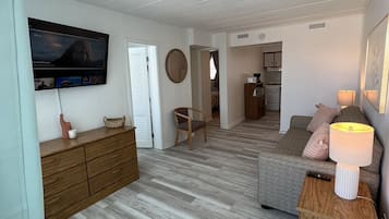 Deluxe Suite | Living area | Flat-screen TV