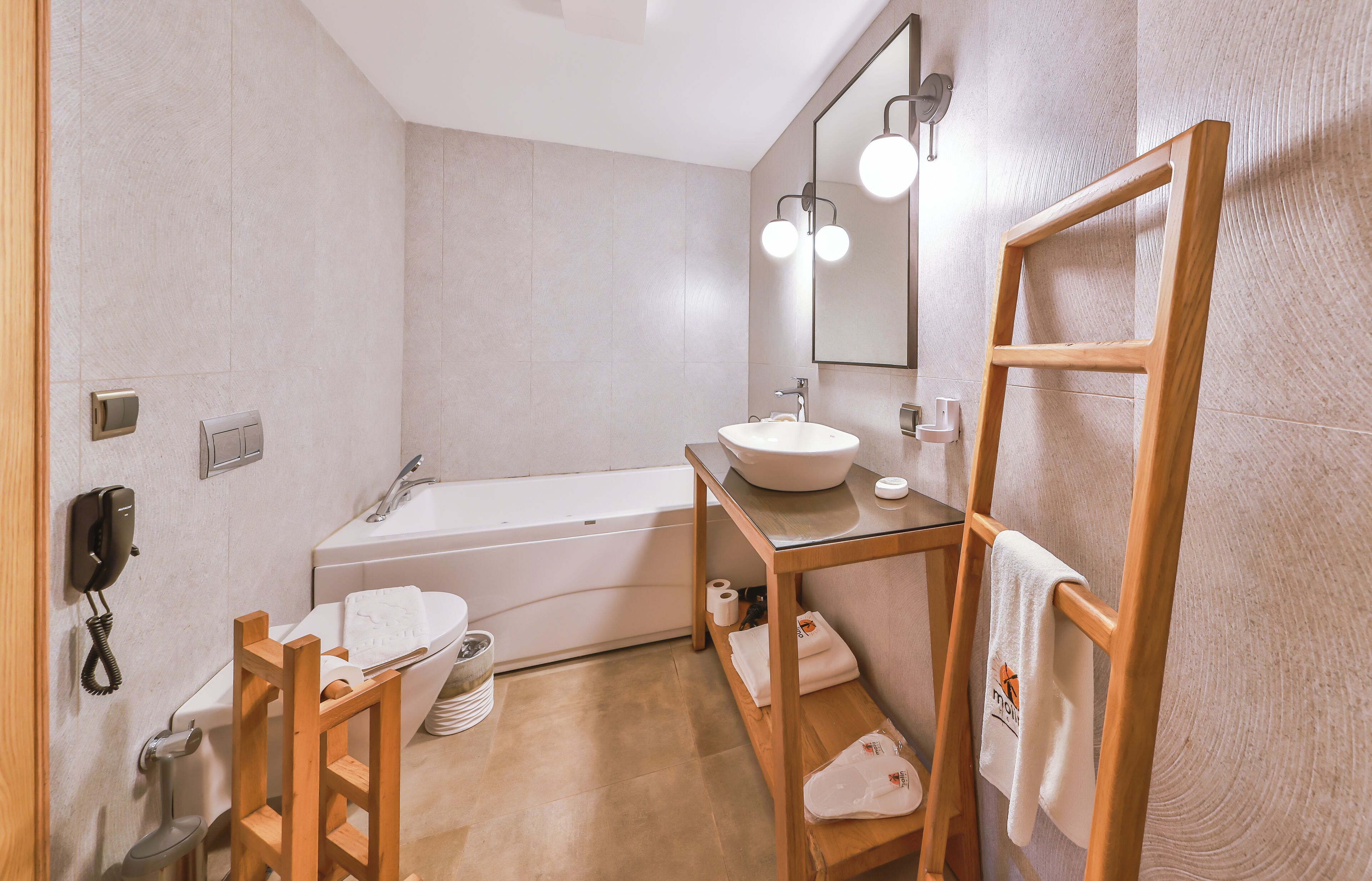 family suite, jetted tub | bathroom | designer toiletries, hair dryer, slippers, bidet