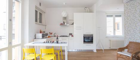 Apartment, 2 Bedrooms | Private kitchen | Full-size fridge, stovetop, cookware/dishes/utensils