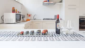 Apartment, 2 Bedrooms | Private kitchen | Full-size fridge, stovetop, toaster, cookware/dishes/utensils