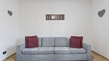 Apartment, 3 Bedrooms | Living area | Flat-screen TV