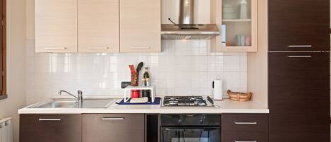 Apartment, 2 Bedrooms | Private kitchen | Full-size fridge, stovetop, cookware/dishes/utensils