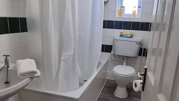 Combined shower/bathtub, hair dryer, towels, soap