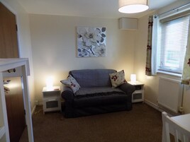 Apartment, 1 Bedroom | Living area | Flat-screen TV