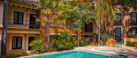 Outdoor pool, open 9:00 AM to 9:00 PM, pool umbrellas, pool loungers