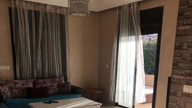 Deluxe Apartment, 2 Bedrooms | Living area | 32-inch flat-screen TV with satellite channels, TV - Appart Bigoux Marina (Saidia)