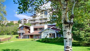 A multi-story building with a sign reading "1920 West". - Mountain Village 2 Level Steps to Ski (Steamboat Springs)