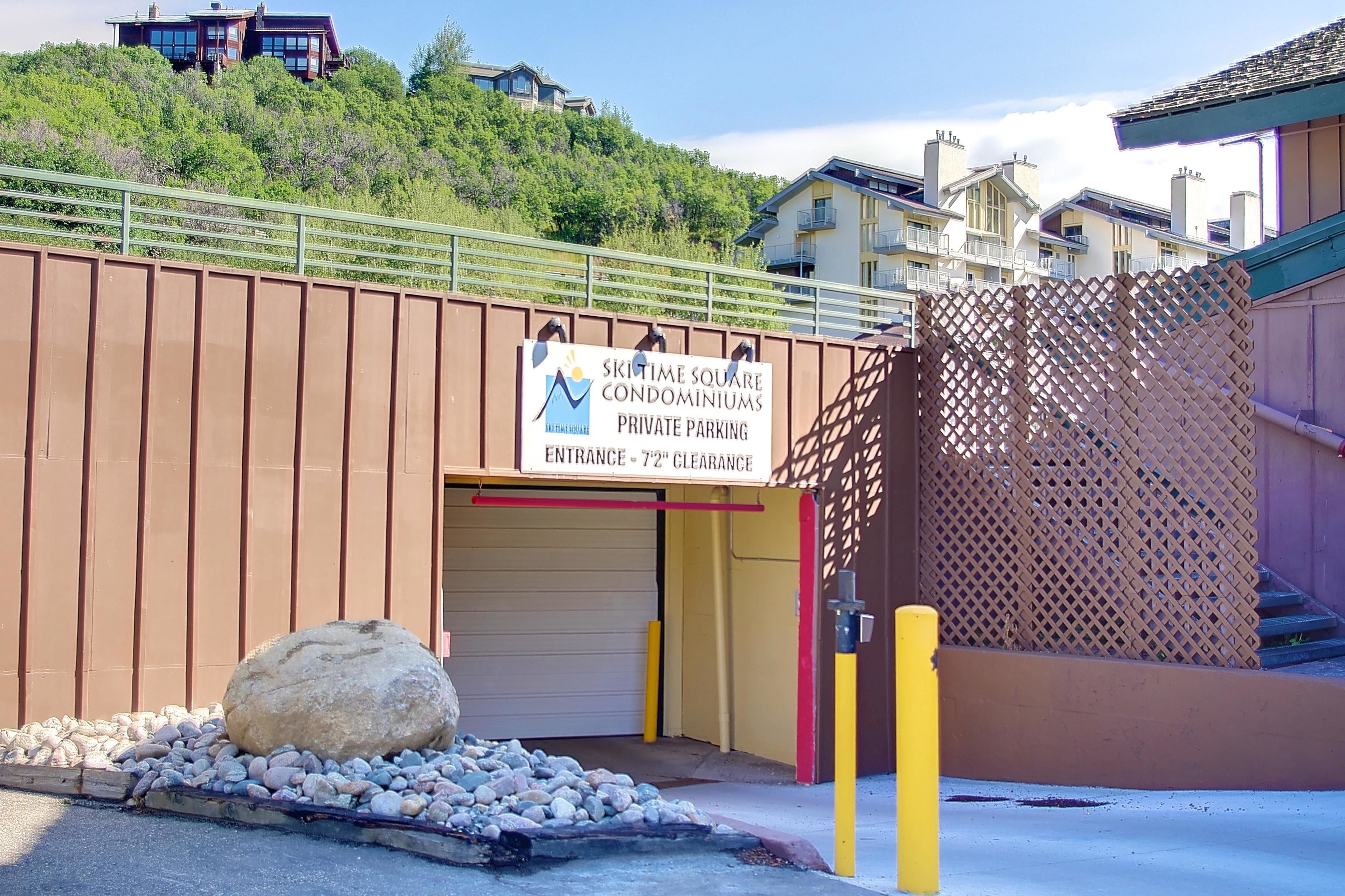 A gated entrance to a residential area with a sign indicating private parking and a 7'2" clearance.