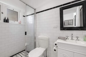 Shower, hair dryer, towels, shampoo