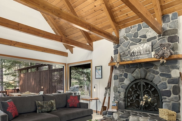 Exposed beams, tall ceilings and vintage decor set the theme of the living room.